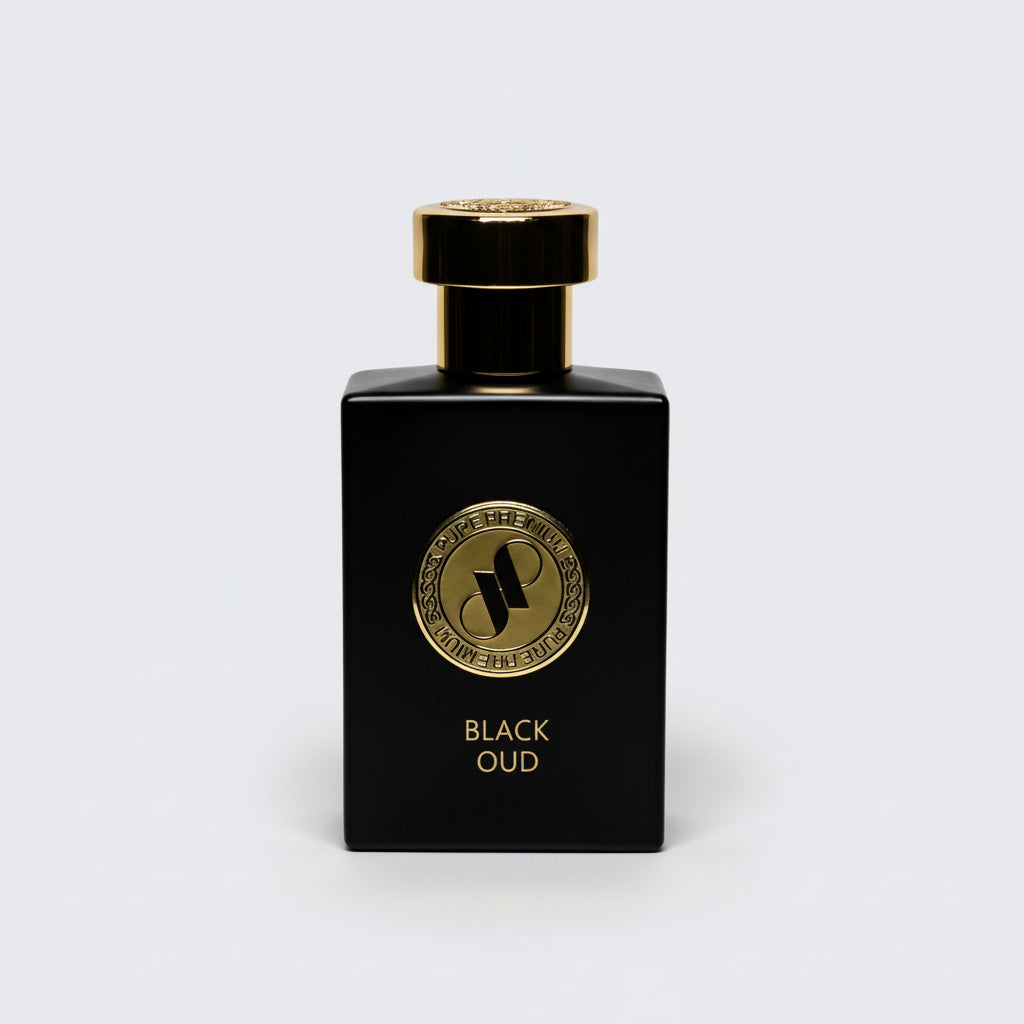 Black perfume bottle with gold cap and label on a light gray background