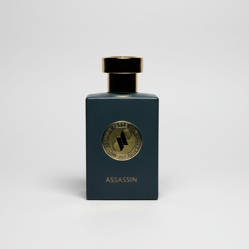 Perfume bottle labeled 'Assassin' on a light gray background