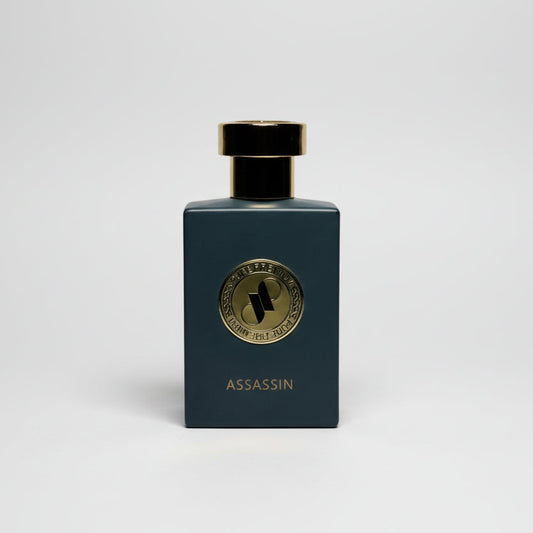 Perfume bottle labeled 'Assassin' on a light gray background